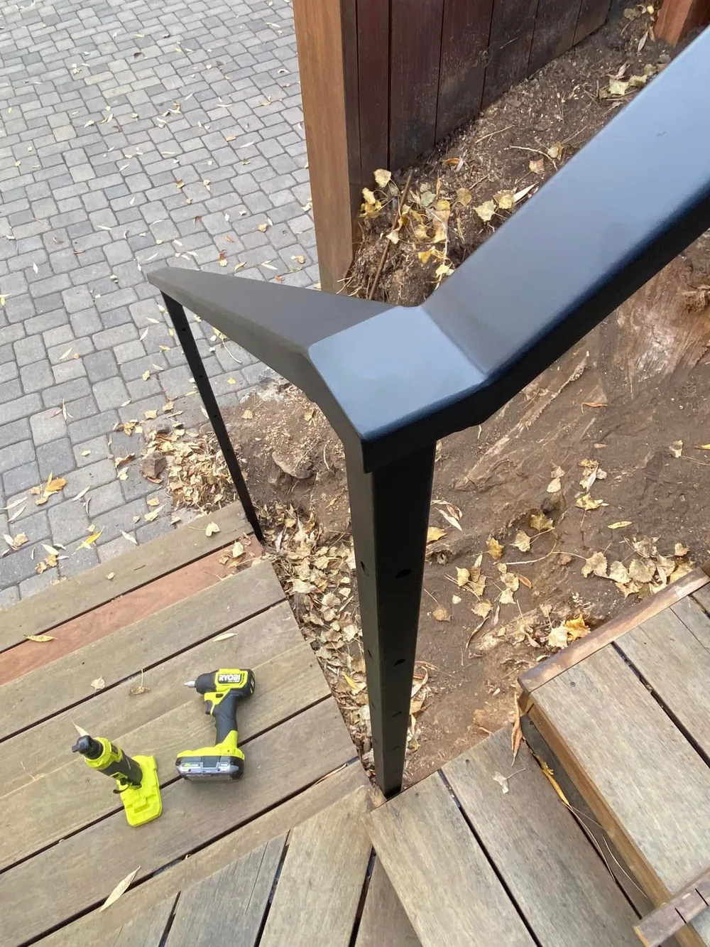 Close view of a finished black steel railing corner